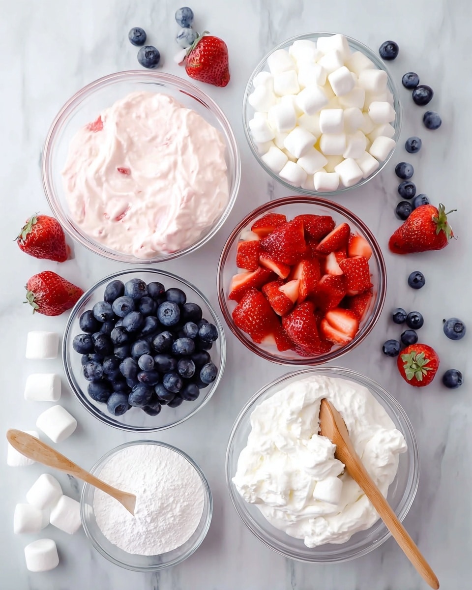 The image shows two views of a clear glass bowl on a white marbled surface, filled with layers. The first layer is red strawberry pieces and whole blueberries mixed together. On top of the berries, there is a layer of small white marshmallows scattered evenly. The second view shows the same bowl with all the layers mixed together into a creamy white mixture with visible pieces of red strawberries, dark blueberries, and white marshmallows evenly spread throughout. Some loose blueberries are on the white marbled surface near the bowl. Photo taken with an iphone --ar 4:5 --v 7