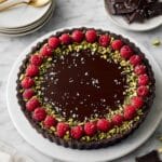 Dark Chocolate Ganache Tart with Pistachios and Raspberries Recipe