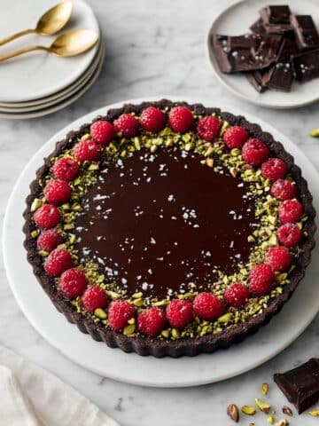 Dark Chocolate Ganache Tart with Pistachios and Raspberries Recipe