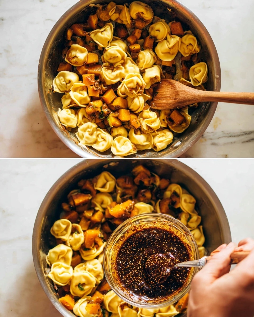 The image shows two views of a silver pan on a white marbled surface, filled with round, yellow tortellini pasta and small pieces of browned orange squash. In the top view, the pasta and squash are mixed with a wooden spoon resting in the pan. In the bottom view, a woman's hand holds a small clear bowl above the pan, pouring a dark, thick sauce with visible seeds over the pasta and squash while the wooden spoon stays in the pan. The lighting is bright and natural, highlighting the golden colors and textures of the food. photo taken with an iphone --ar 4:5 --v 7