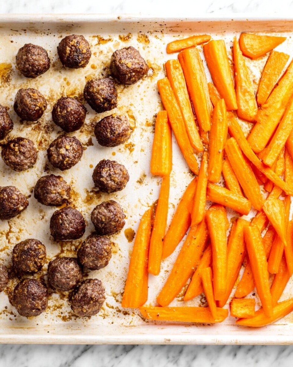The image shows a white baking tray with two sections of food on a white marbled surface. On the left side, there are about fifteen small, round dark brown meatballs with slight crispy spots and small bits of seasoning visible on the surface. On the right side, there are several bright orange carrot sticks cut into varying lengths, slightly roasted with a bit of shine and a soft texture. The food sits directly on the tray with some brown caramelized spots around the meatballs and carrot sticks. photo taken with an iphone --ar 4:5 --v 7