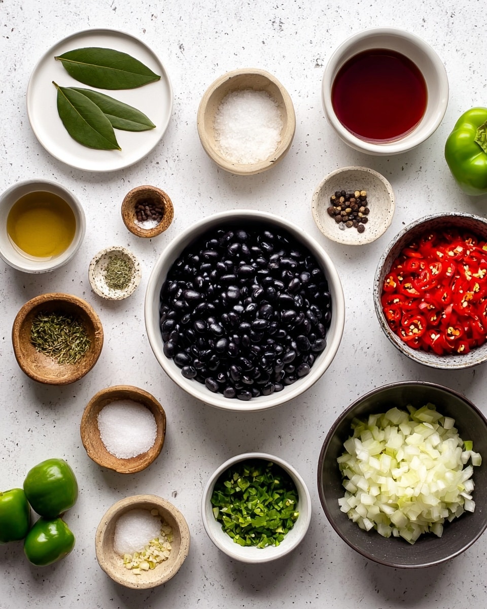 This image shows a top-down view of multiple small bowls and plates with chopped ingredients placed on a white marbled surface. In the center is a large white bowl filled with shiny black beans. Surrounding it, clockwise from top left, are a white plate with two green bay leaves, a white bowl with red liquid, a small brown bowl of salt, a small dark brown bowl of coarse salt, a white bowl filled with chopped red chili peppers, a small light brown bowl of coarsely ground black pepper, a dark bowl holding two whole green peppers and a white onion quarter, a small light brown bowl with brown powder, a small white bowl with dried herbs, a dark bowl full of chopped green pepper, a small beige bowl with chopped garlic, and a larger beige bowl of chopped white onion. The ingredients are neatly arranged and well-lit. Photo taken with an iphone --ar 4:5 --v 7