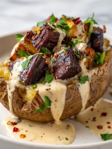 Loaded Baked Potato with Steak Bites and Parmesan Cream Sauce Recipe