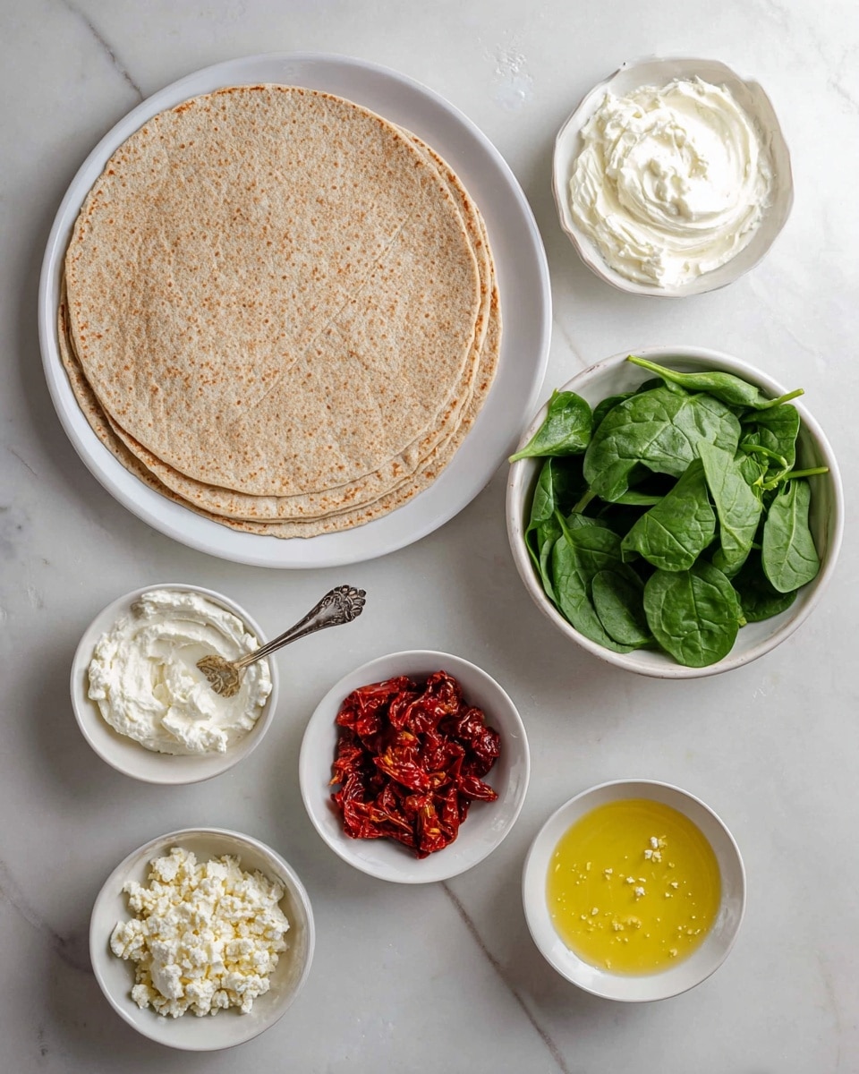 The image shows a top view of several white bowls and a white plate on a white marbled surface. On the large white plate to the left are three whole wheat tortillas stacked, light brown and slightly textured. Surrounding the plate are five small white bowls: one with smooth white cream cheese and a silver spoon, one with bright green fresh spinach leaves, one with small white crumbled cheese, one with bright red sun-dried tomato pieces, and one with yellow melted butter showing some bubbles. The arrangement is neat with a clean and fresh look. Photo taken with an iphone --ar 4:5 --v 7