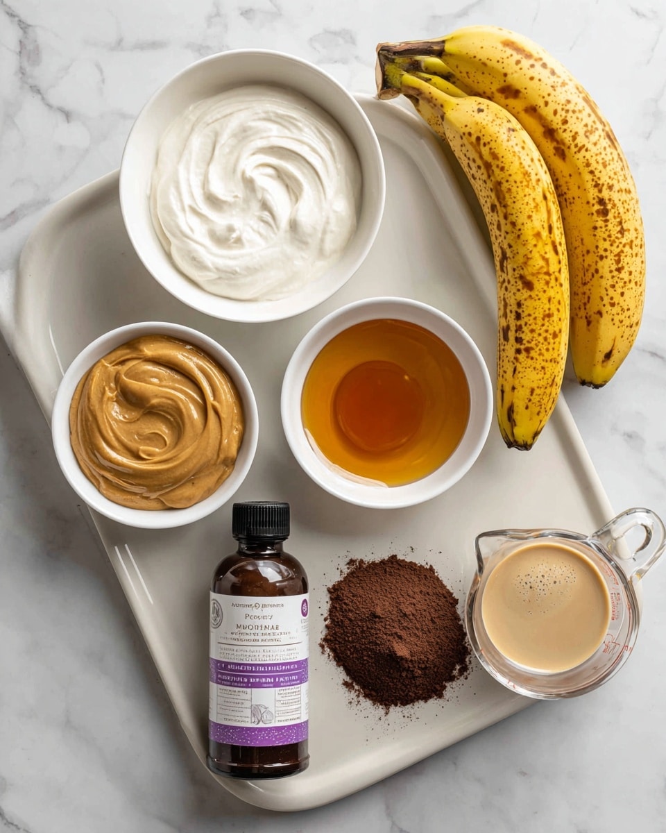 A top view shows a white baking sheet with four white bowls arranged in a square at the top; the top left bowl has a thick white creamy ingredient, the top right bowl contains smooth golden peanut butter, the bottom left bowl holds a shiny amber-colored honey, and the bottom right bowl has a fine dark brown cocoa powder. Below the bowls, a bottle of Madagascar vanilla bean paste with a purple and white label stands upright, flanked by two yellow bananas with brown spots on the left and a clear glass measuring cup filled with a creamy tan liquid on the right. The background is a white marbled texture. photo taken with an iphone --ar 4:5 --v 7