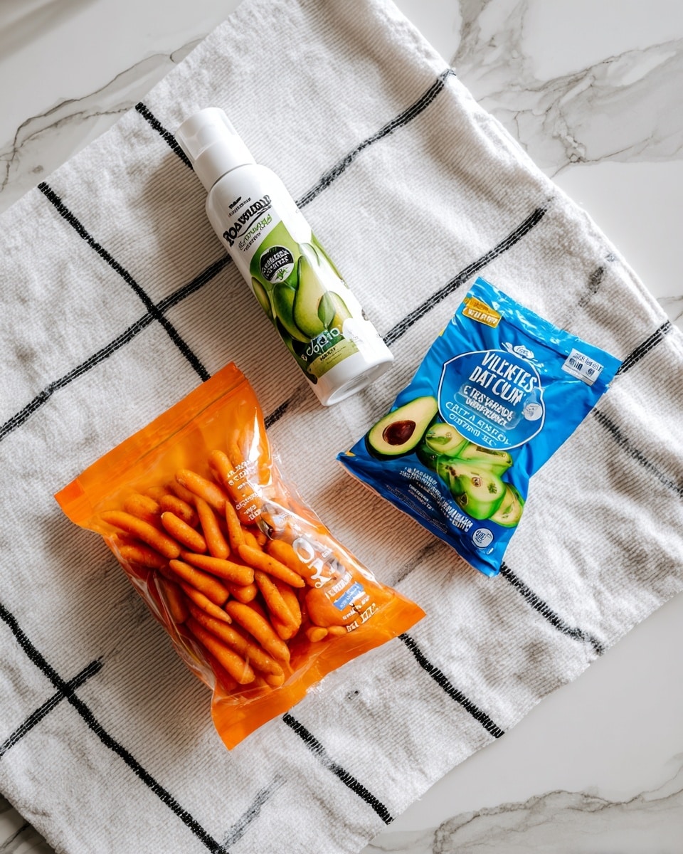 The image shows three food items placed on a white cloth with black lines, resting on a white marbled textured surface. The top item is a white can of avocado oil spray with a green avocado picture on it. Below and to the right is a blue and green packet of Hidden Valley Ranch dressing mix. At the bottom left is an orange plastic bag of Bolthouse Farms Premium Sweet Petites baby carrots, with a transparent front showing the carrots inside. The photo taken with an iphone --ar 4:5 --v 7