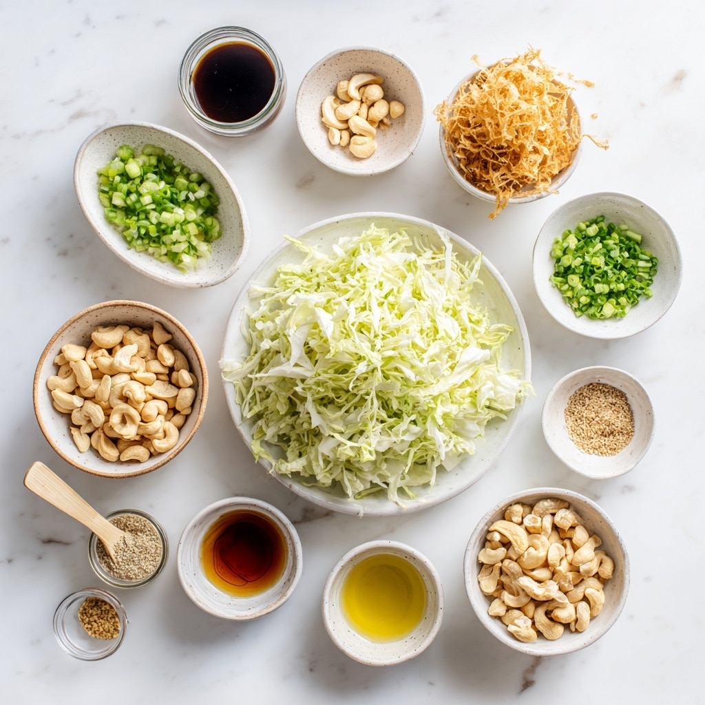A close-up image of a blue patterned bowl filled with a fresh salad sitting on a white marbled surface. The salad has three main layers: a base of chopped green leafy vegetables, sprinkled with white sesame seeds, topped with a mix of golden brown cashews and crispy brown pieces, and shredded light-colored chicken mixed evenly throughout. A silver spoon rests inside the bowl while a woman's hand holds a small jar above it, pouring a light golden dressing over the salad, with droplets caught in mid-air. Photo taken with an iphone --ar 4:5 --v 7
