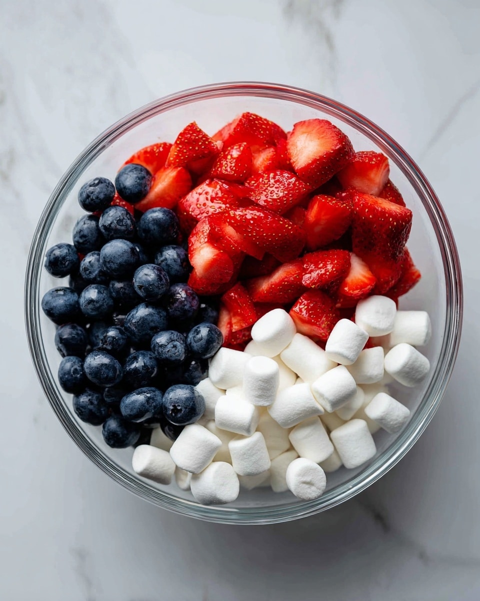 A clear glass bowl sits on a white marbled surface, filled with a layer of fine white powdered sugar. On top of the sugar rests a rectangular block of creamy off-white butter, with a soft texture showing slight indents and smooth areas. The bowl is centered in the image, and the light creates gentle shadows that highlight the powder and butter edges. photo taken with an iphone --ar 4:5 --v 7