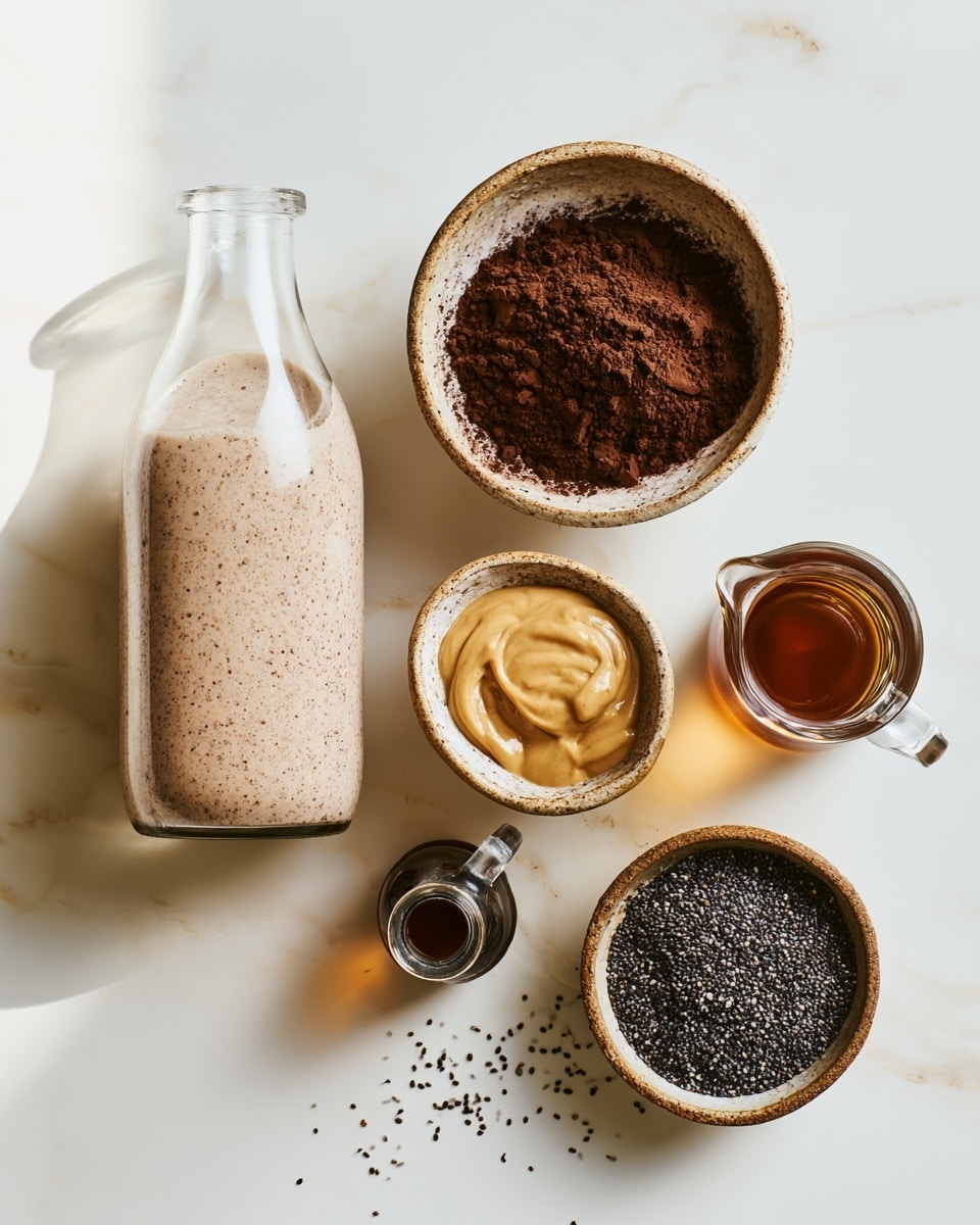 A close-up view of a clear glass jar filled with a light brown liquid base at the bottom, topped with a thick layer of small, dark chia seeds covering the surface almost fully. The chia seeds have a mix of dark gray, black, and some light brown colors, creating a speckled texture. The jar's metal clasp is slightly blurred in the foreground, while the jar is placed on a white marbled surface. The lighting is soft and natural, highlighting the texture of the chia seeds and the glass jar itself. Photo taken with an iphone --ar 4:5 --v 7