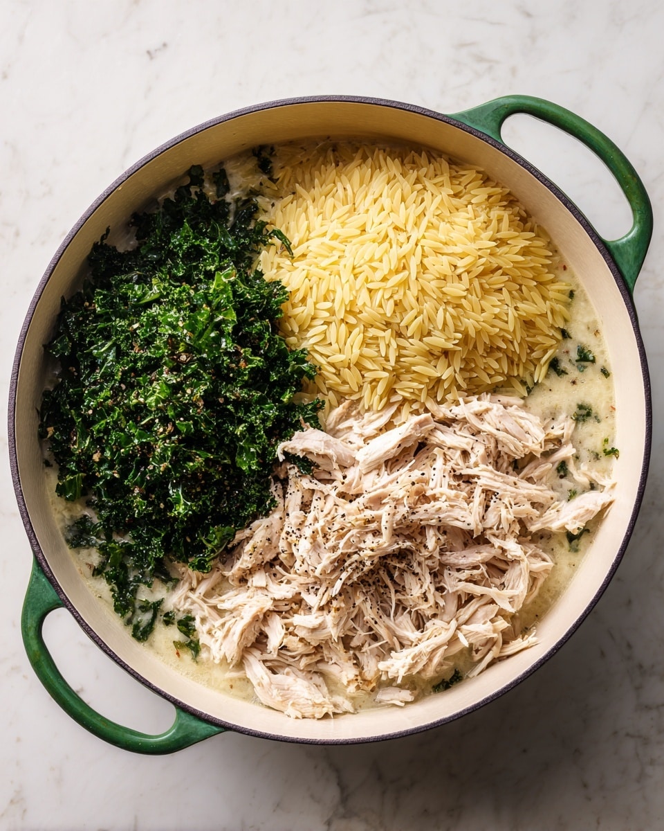 A white enamel pot with green handles is set on a white marbled surface, filled with three separate layers of ingredients. On the left side, there is a pile of finely chopped dark green kale, its texture leafy and fresh. To the right of the kale is a mound of uncooked yellow orzo pasta, each grain small and smooth. In the center, there is a heap of light beige shredded cooked chicken, showing fibrous texture. All layers sit on a liquid base that looks creamy and pale, seasoned with specks of black pepper. photo taken with an iphone --ar 4:5 --v 7