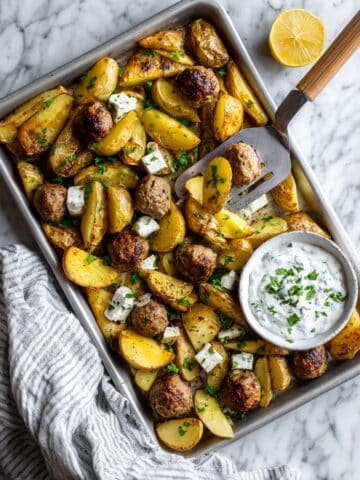 Sheet Pan Greek Meatballs and Potatoes with Lemon Herb Yogurt Sauce Recipe